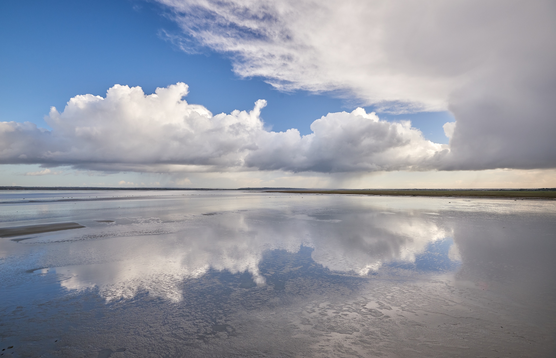 Mont Saint-Michel reflected in the sand