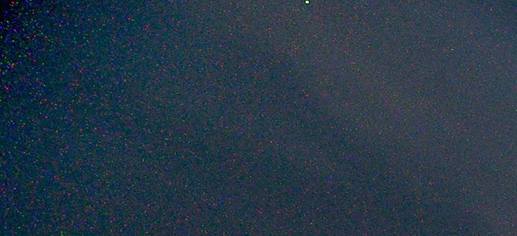 100% crop of a Canon R5 long exposure showing colored hot pixel noise in the shadows at ISO 100